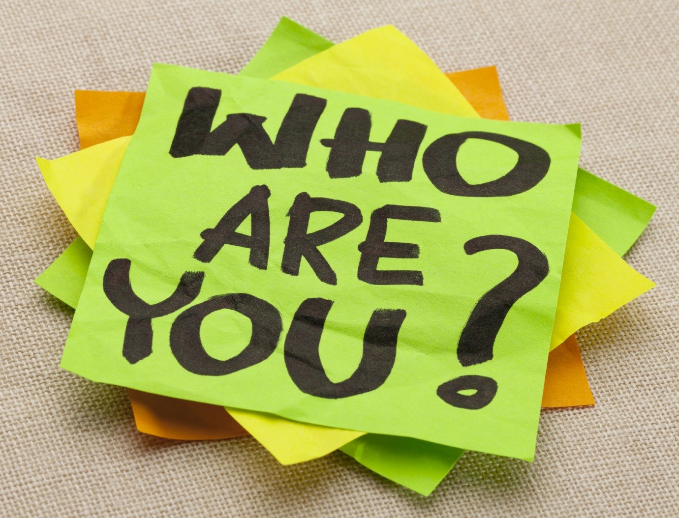 Who are you question - handwriting on a green sticky note